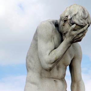 Stone statue of Adam ashamed