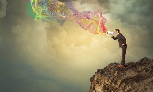 Man on mountain speaking out - blog - Ready to Rise BW